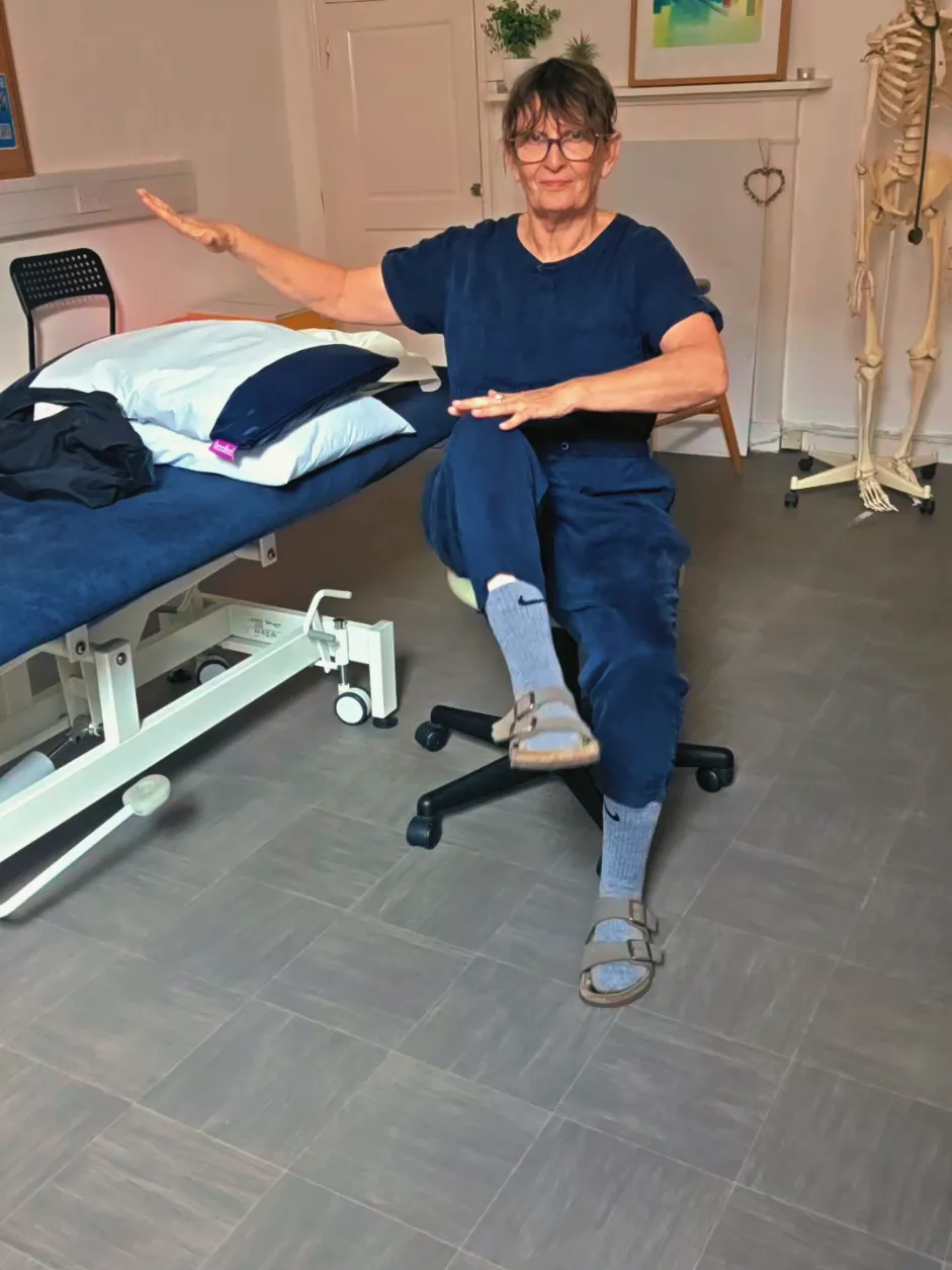 Clare demonstrating: chair aerobics